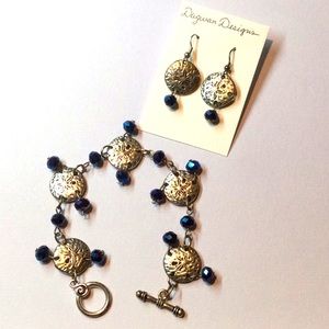 Silver dollar set with blue stones
